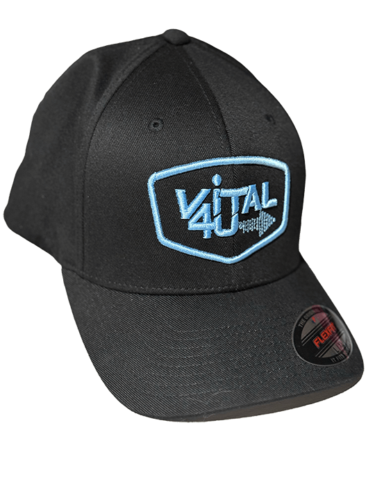 A side view of a black hat with sky blue embroidered Vital 4U logo.