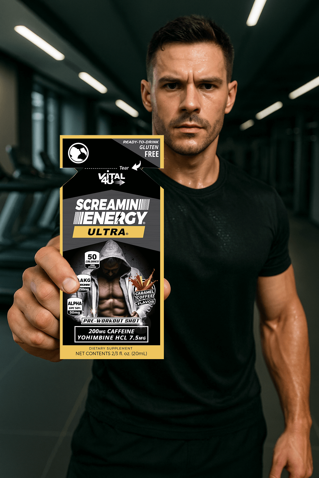 A man at the gym holding a Screamin Energy Ultra Caramel Coffee Flavored pre-workout shot.