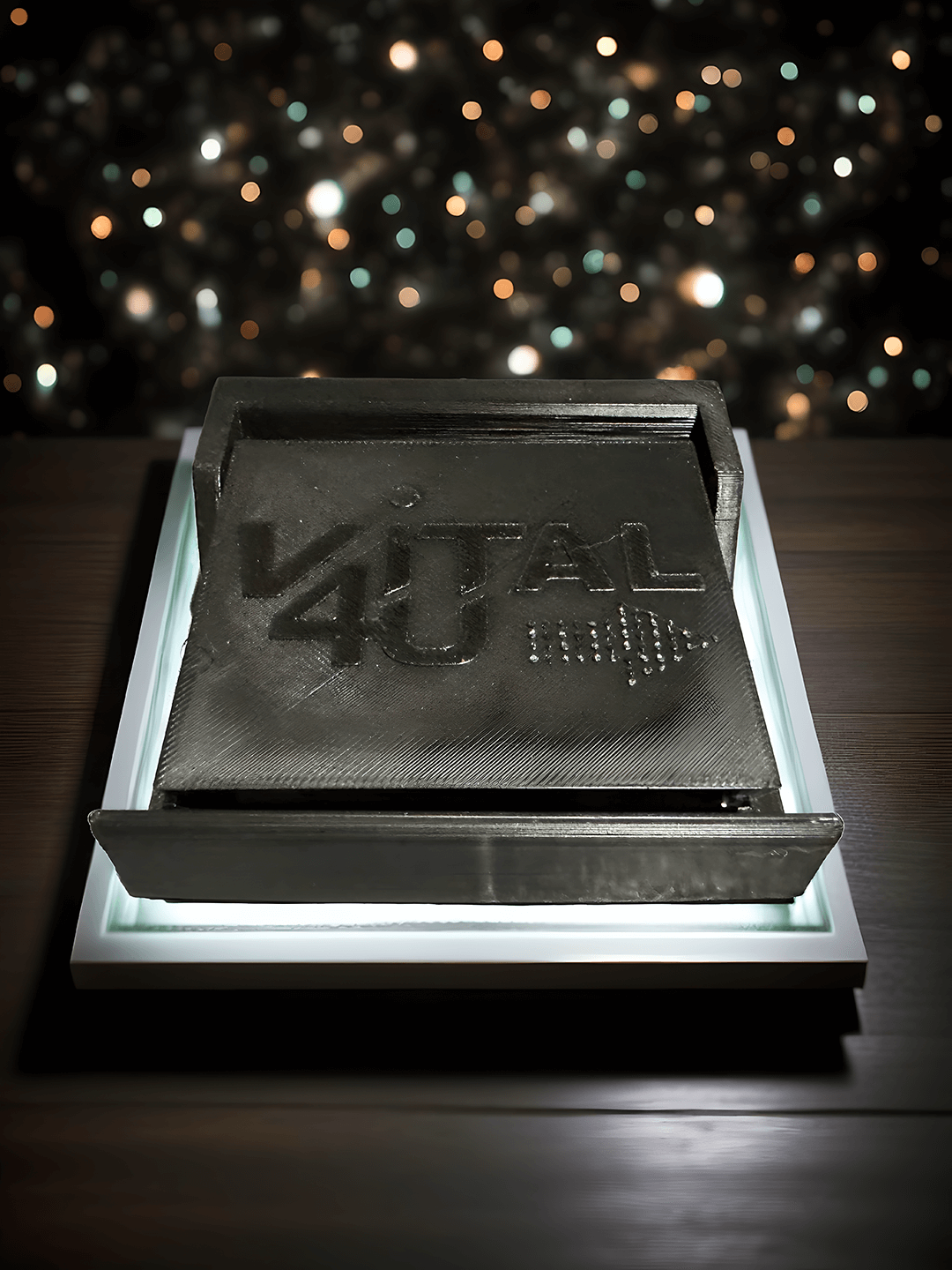 An overhead view of the Energy Dock energy drink holder with the Vital 4U logo.