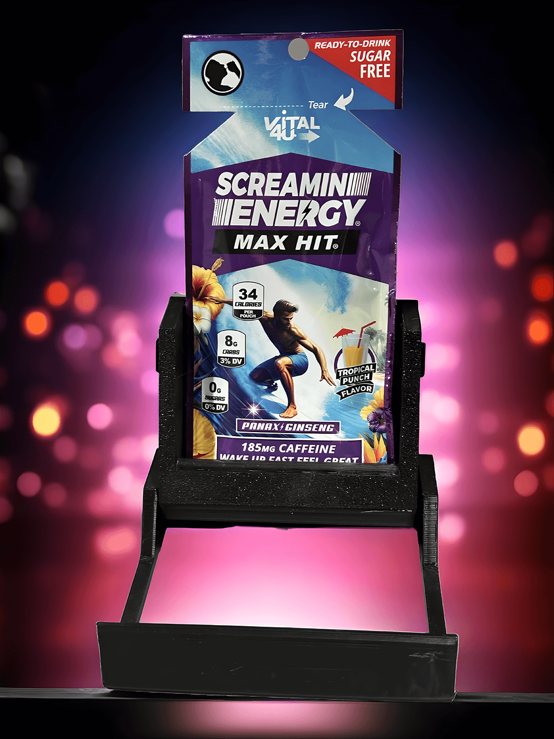 The Screamin Energy Max Hit Tropical Punch liquid energy pouch held in the black Energy Dock stand.